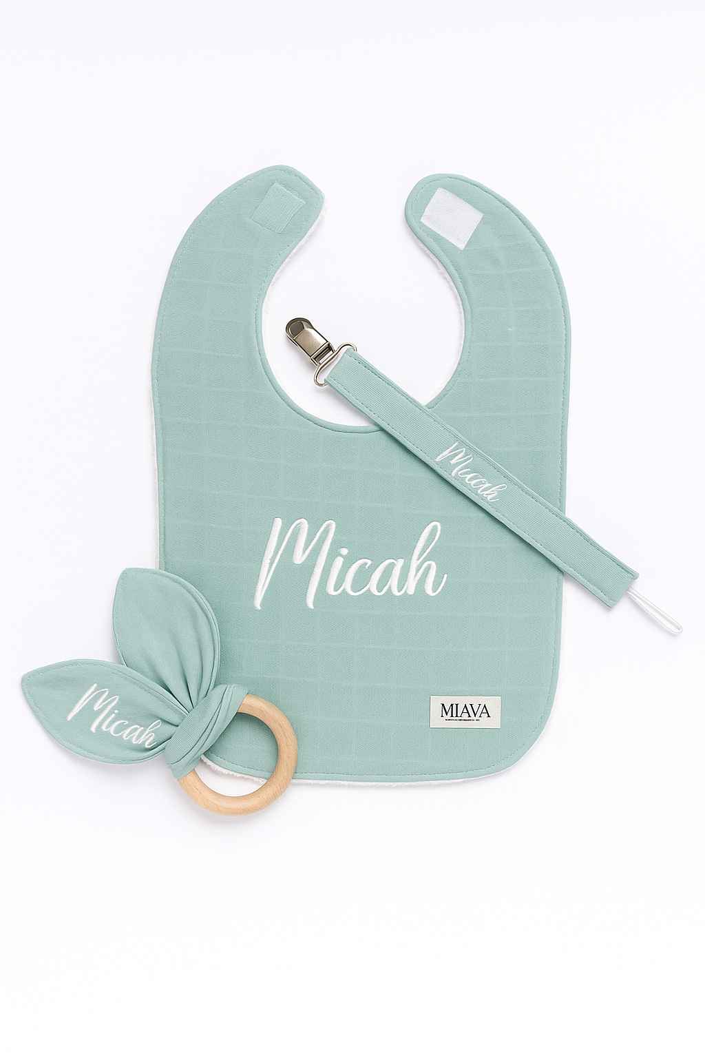 Bib, dummy clip and toy set